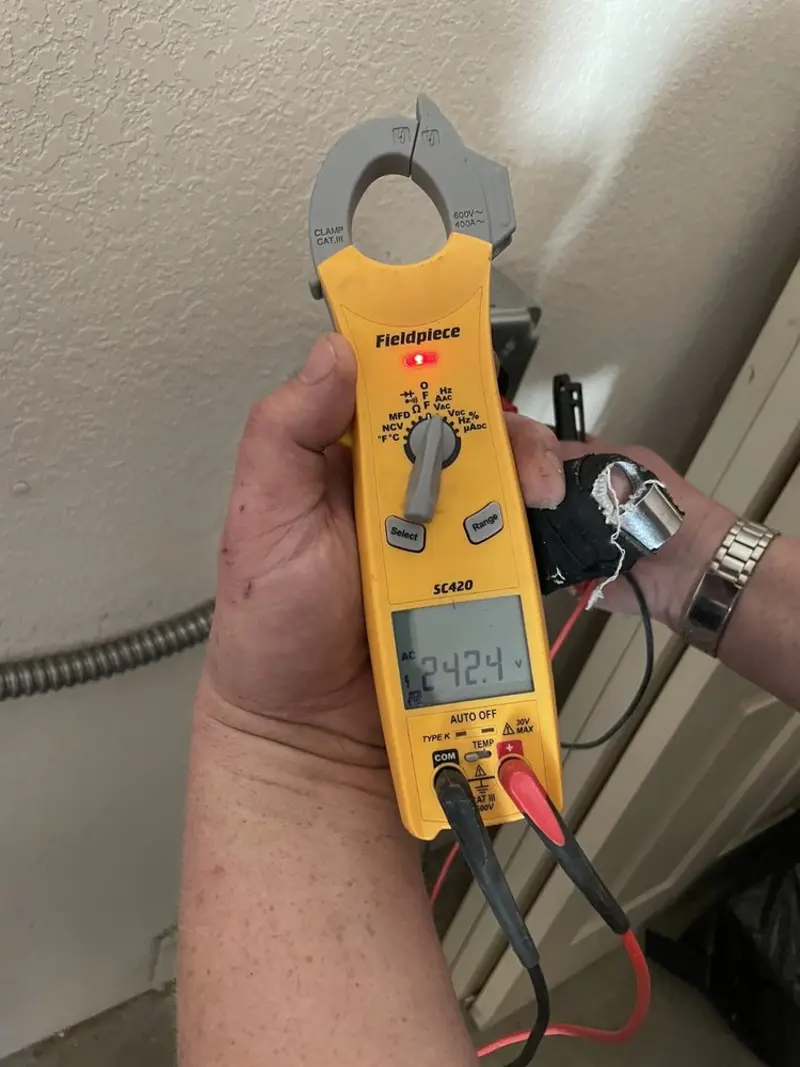 Voltage testing with clamp meter during Ceiling Fan Installation in East Fishkill